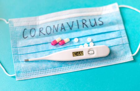 Coronavirus. Remedies. Masks on a blue background. Selective focus medicineの写真素材