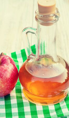 Apple cider vinegar in a bottle. Selective focus. nature.の写真素材