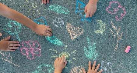 Children's drawings on the asphalt with chalk. Selective focus. nature.の写真素材