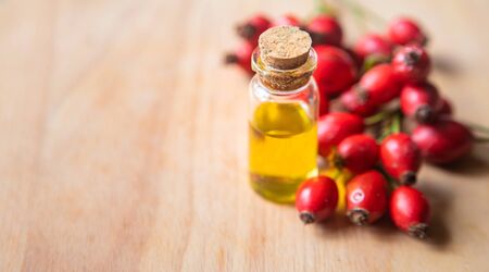 Rosehip seed essential oil in a small bottle. Selective focus. nature.の写真素材