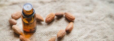 Almond essential oil in a small bottle. Selective focus. nature.の写真素材