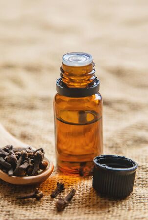 Clove essential oil in a small bottle. Selective focus. nature.の写真素材
