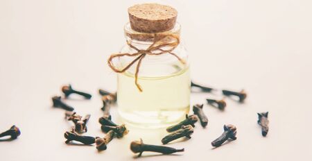 Clove essential oil in a small bottle. Selective focus. nature.の写真素材