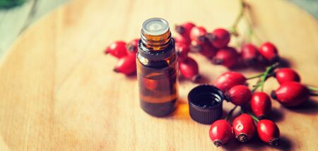 Rosehip seed essential oil in a small bottle. Selective focus. nature.の写真素材