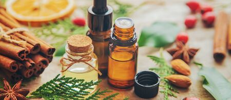 Christmas essential oils in a small bottle. Selective focus. Holiday.の写真素材