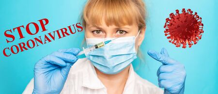 Doctor with a syringe in his hands. Selective focus.の写真素材