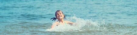 A child drowns in water at sea. Selective focus.の写真素材