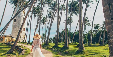 Girl in Sri Lanka on an island with a lighthouse. Selective focus. nature.の写真素材