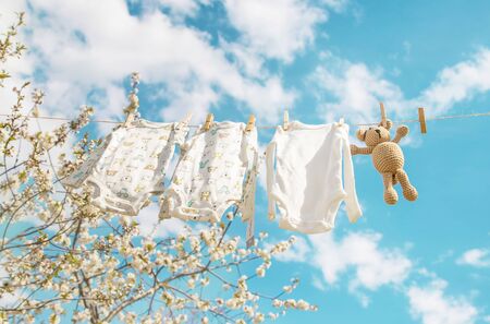 Baby clothes are drying on the street. Selective focus. nature.の写真素材