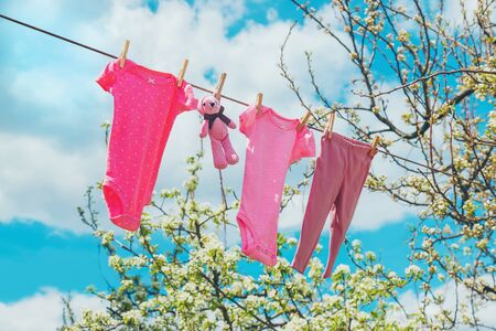 Baby clothes are drying on the street. Selective focus. nature.の写真素材