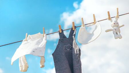 Baby clothes are drying on the street. Selective focus. nature.