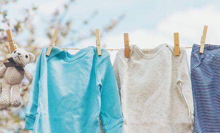 Baby clothes are drying on the street. Selective focus. nature.