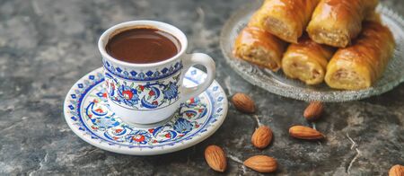 A cup of Turkish coffee and baklava. Selective focus. drink.の写真素材