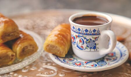 A cup of Turkish coffee and baklava. Selective focus. drink.の写真素材