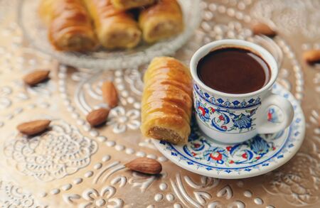A cup of Turkish coffee and baklava. Selective focus. drink.の写真素材