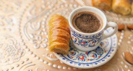 A cup of Turkish coffee and baklava. Selective focus. drink.の写真素材