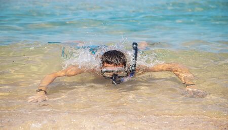 A man at the sea in fins and mask. Selective focus. nature