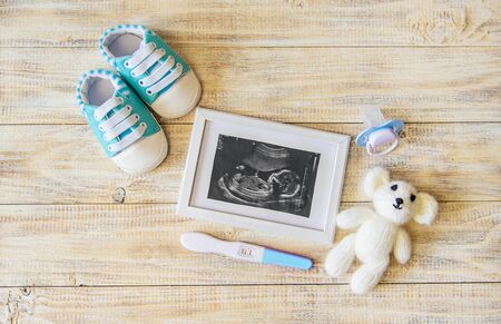 Ultrasound picture of a baby's photograph and accessories. Selective focus. child.