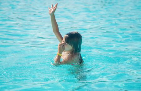 kid is drowning in the sea. Selective focus. nature.の写真素材