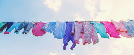 Baby clothes are drying on the street. Selective focus. nature.の写真素材