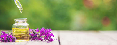 Lavender essential oil in a small bottle. Selective focus.nature.の写真素材