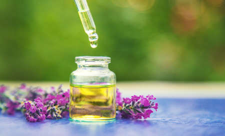 Lavender essential oil in a small bottle. Selective focus.nature.の写真素材