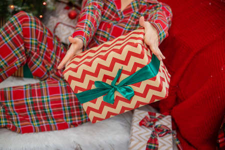 people with Christmas gifts in their hands. selective focus. happy.