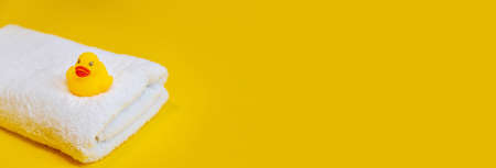 Accessories for bathing newborns on a yellow background. Selective focus. Baby.の写真素材