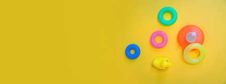 Accessories for newborns on a yellow background. Selective focus. Baby.の写真素材