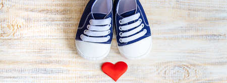 Baby booties and heart on a light background. Selective focus. nature.の写真素材