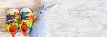 Baby booties and accessories on a light background. Selective focus.の写真素材