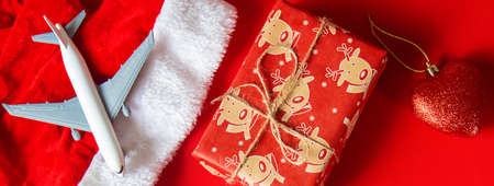 Christmas background red with airplane. Selective focus. Holiday.
