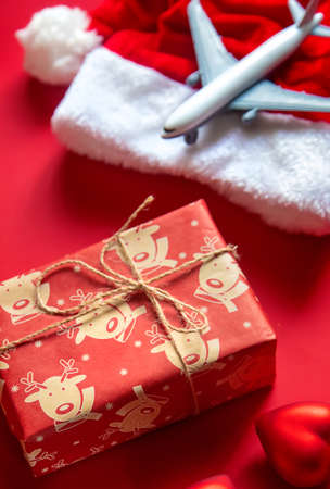 Christmas background red with airplane. Selective focus. Holiday.の写真素材