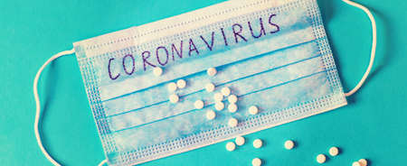 Coronavirus. Remedies. Masks on a blue background. Selective focus medicineの写真素材