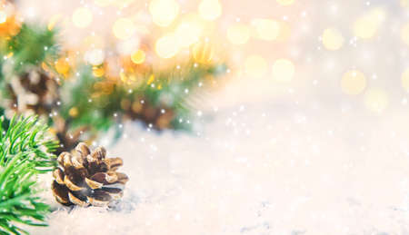 Christmas decor, pine cones in the snow. Selective focus. Holiday.