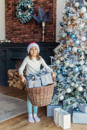 Christmas photo child with gifts. Selective focus. Holiday.の写真素材