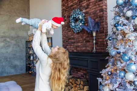 Christmas photo of baby and mother. Selective focus. holiday.