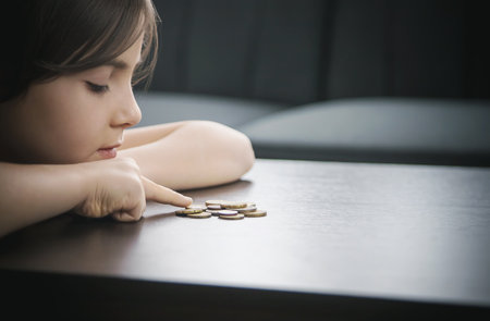 Child counts coins, poverty concept. Selective focus Peopleの写真素材