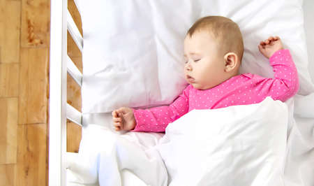 Baby baby sleeps in the crib. Selective focus. Child.