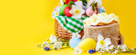 Happy Easter with flowers on a yellow background. Celebration. Selective focus. Holiday.