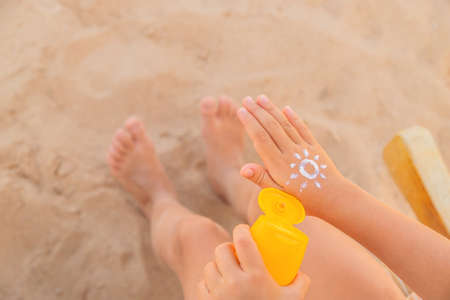 Sunscreen on the skin of a child. Selective focus. nature.