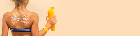 Sunscreen on the skin of a child. Selective focus. nature.