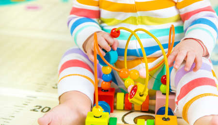 Baby plays with an educational toy. Selective focus. Child.の写真素材