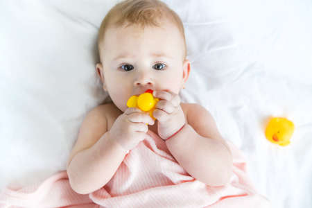 Baby after bathing in a towel. Selective focus. Child.