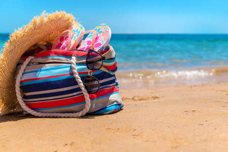 Bag and things for relaxing on the sea beach. Selective focus. Nature.の写真素材