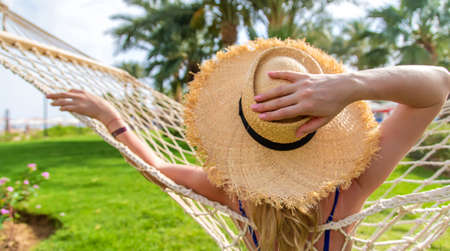 Woman relaxation on a hammock. Selective focus. People.の写真素材