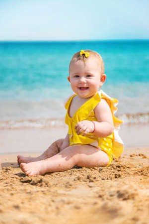 Baby on the beach near the sea. Selective focus. Nature.