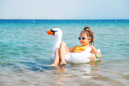 The child swims in a circle in the sea. Selective focus. Kid.の写真素材