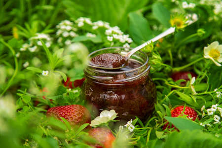 Homemade strawberry jam in a jar. Selective focus. Food.の写真素材