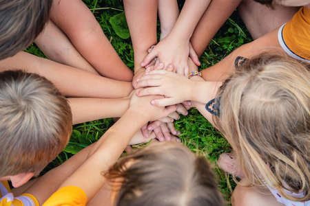 Children are playing with their hands clasped together. Selective focus. Kids.の写真素材